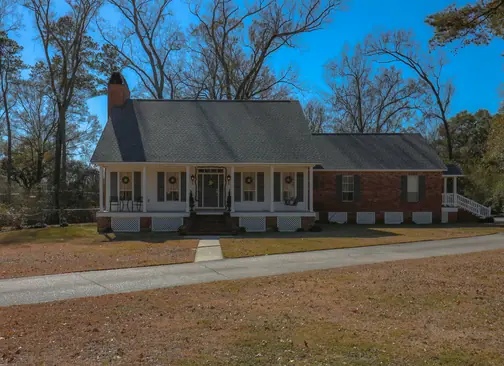 A brick home with a front porch