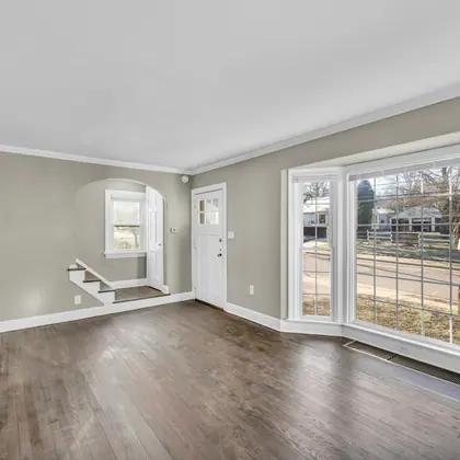 A bright, empty living room after a cleanout